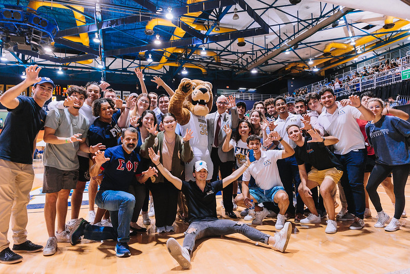 FIU alumni and students at a basketball game