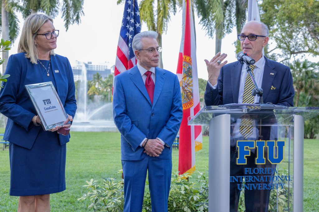 FIU President Kenneth A. Jessell (right) with CasaCuba Executive Director Lydia “Lili” Betancourt Space, MS ’00 (left), recognizing Benjamín León Jr. (center) for his support at the CasaCuba gift announcement in January 2024.